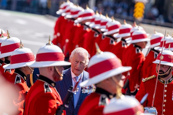 King Charles inspects an honour guard as he arrives at the Senate building in Ottawa.