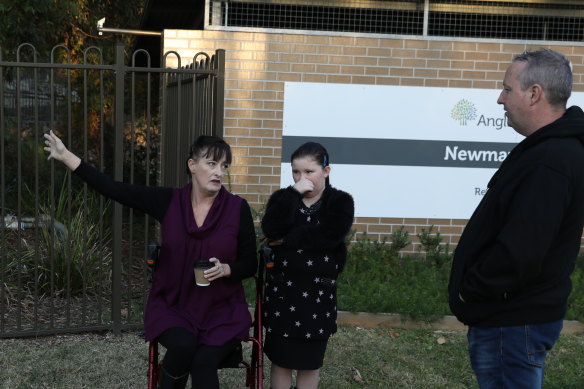 Relatives of Newmarch House residents outside the home on Tuesday: Liz Lane with daughter Samantha and Anthony Bowe.  
