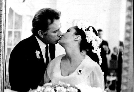 Burton and Taylor captured in the mirror  of their Montreal hotel suite after their wedding in March 1964.