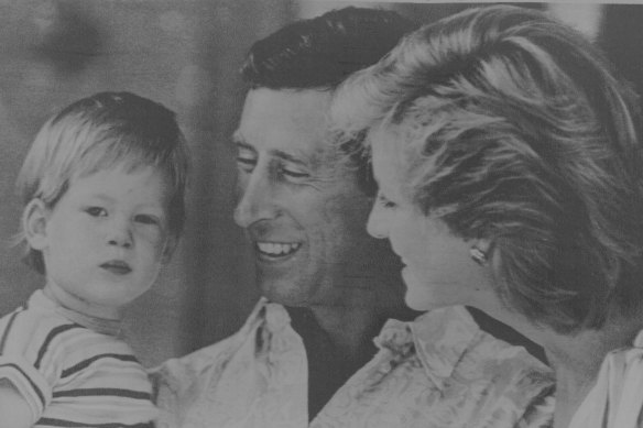 Prince Charles and Princess Diana try to get their son Harry, 2, to smile to the cameras in Spain.