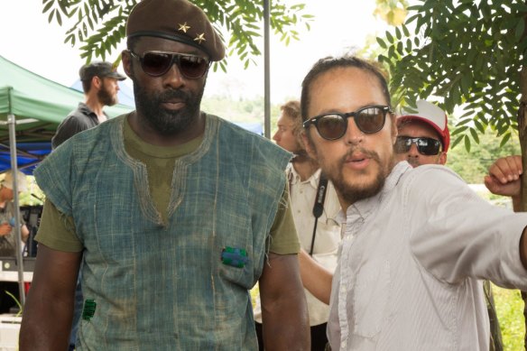 Director Cary Fukunaga, with actor Idris Elba, on the set of "Beasts of No Nation".
