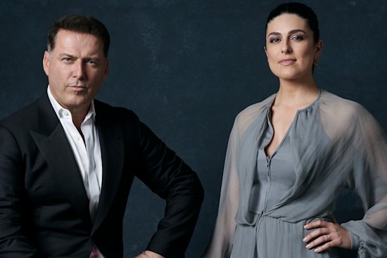 Stefanovic wears a Giorgio Armani jacket and shirt, and Okanui shorts. Abo wears a Giorgio Armani dress and Jimmy Choo shoes.