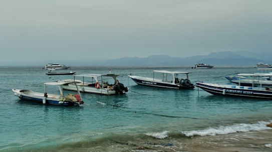 Tour boats anchored at Nusa Penida, a top snorkelling destination in Bali.