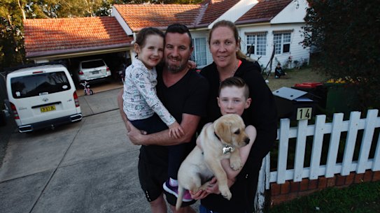 Kevin and Katy Noone with their children Finn and Zara pictured out front of their home with their new puppy Georgia.