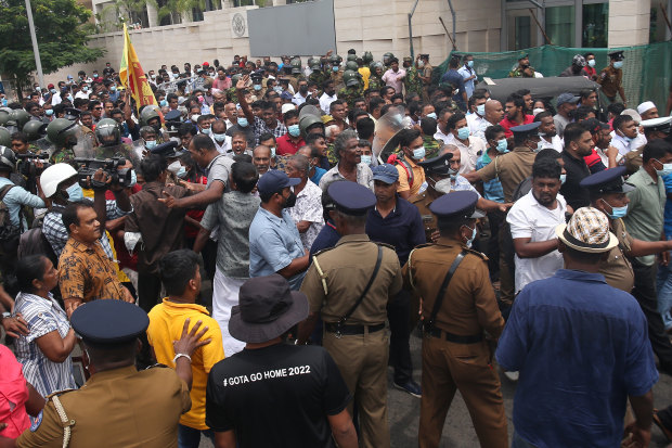 Protesters and pro-government supporters clash in Colombo on 
May 9, resulting in nine deaths. 