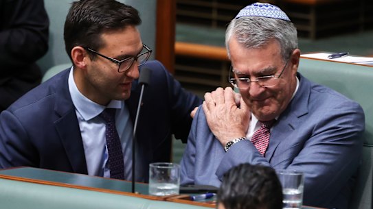 Labor MP Josh Burns consoles Mark Dreyfus after he spoke during a condolence motion for the victims of the Bondi antisemitic terror attack.
