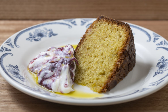 Olive oil cake with fruit-swirled yoghurt.