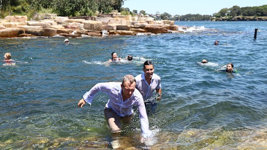 NSW Cities Minister Rob Stokes and member for Sydney Alex Greenwich take a plunge at Marrinawi Cove.