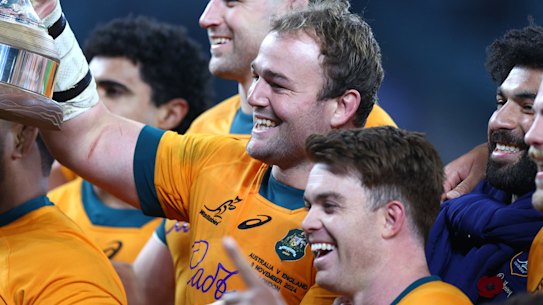 Australian captain Harry Wilson with the Ella-Mobbs trophy.