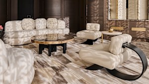 A pair of Brazilian modernist Oscar Niemeyer Alta chairs in ivory leather set off a living area.