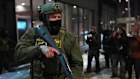 A federal agent stands guard in Minneapolis.