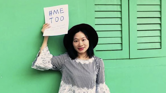 Chinese journalist Huang Xueqin holds up a #Metoo sign for a photo in Singapore in September 2017. 