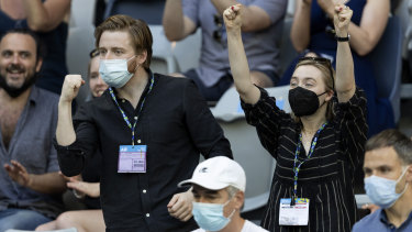 Saoirse Ronan (right) and boyfriend Jack Lowden cheer during  Andy Murray’s defeat by Taro Daniel.