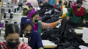 Bangladeshis at work in a garment factory near Dhaka, Bangladesh.