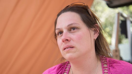 Courier driver Sophie Bryden, 38, poses for a photo at Canungra Sports and Recreation Ground in Canungra, Queensland.
