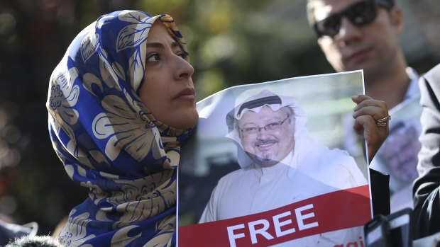 Holding a picture of missing Saudi writer Jamal Khashoggi, Tawakkol Karman, the Nobel Peace Prize laureate for 2011, talks to members of the media near the Saudi Arabia consulate in Istanbul, on Friday.