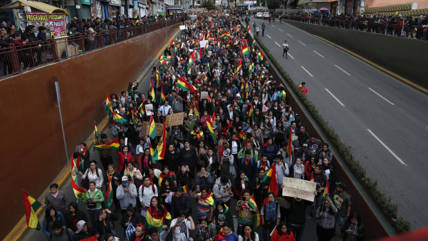Anti-government protesters march demanding a second round presidential election, in La Paz, Bolivia.