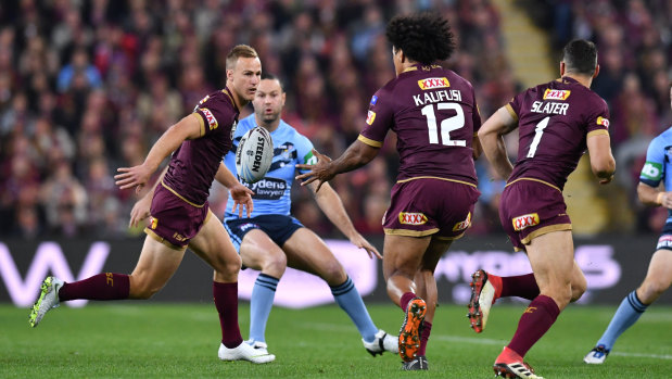 Daly Cherry-Evans feeds Felise Kaufusi during this year's State of Origin series.