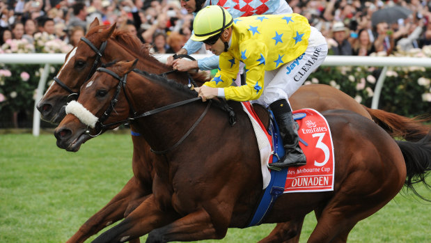 Jockey Christophe Lemaire (in yellow) rides Dunaden to victory in the 2011 Melbourne Cup.