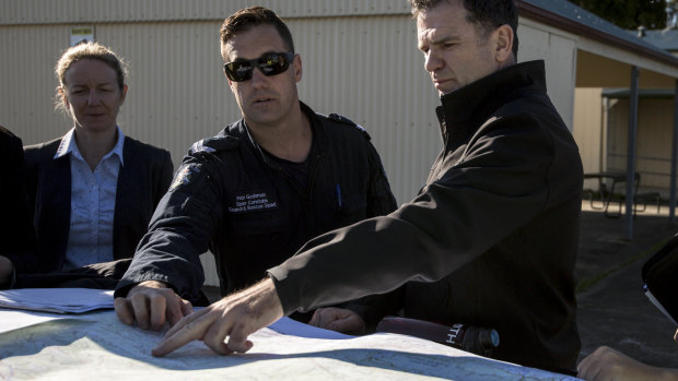 Detective Inspector Andrew Stamper leads the police search near Labertouche on Monday.