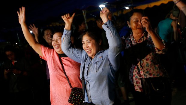 Thais celebrate the rescue of the Wild Boars soccer team and their coach.