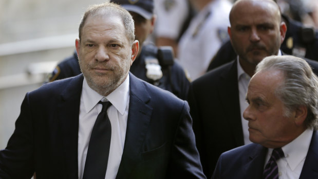 Harvey Weinstein arrives at court with his lawyer in June.