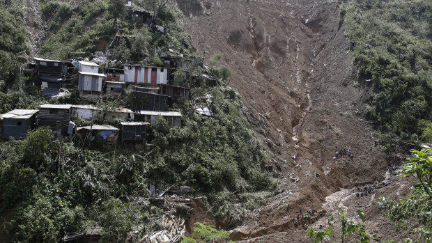 Houses are perched alongside a landslide believed to have buried a number of victims after Typhoon Mangkhut barreled across Itogon, Benguet province, northern Philippines.