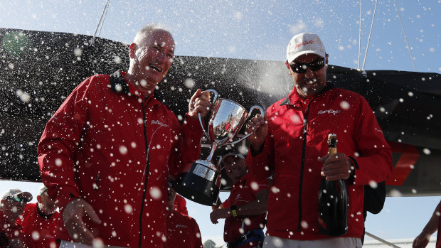 Champagne sailing: Sandy Oatley (left) and Mark Richards hold the J.H. Illingworth Cup for Sydney to Hobart line honours.