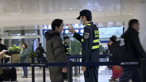 Screening for coronavirus is happening at airports around the world, including in Wuhan.