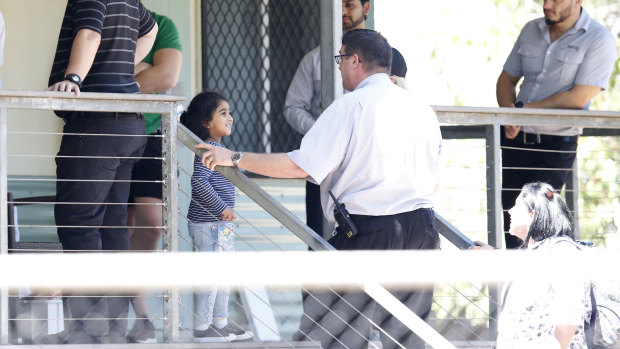 Little girl Kopika is pictured at a secure apartment section of the Mercure Hotel in Darwin on Friday.