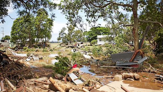 Emergency services search for bodies in the town of Grantham, devastated by the sudden flood.