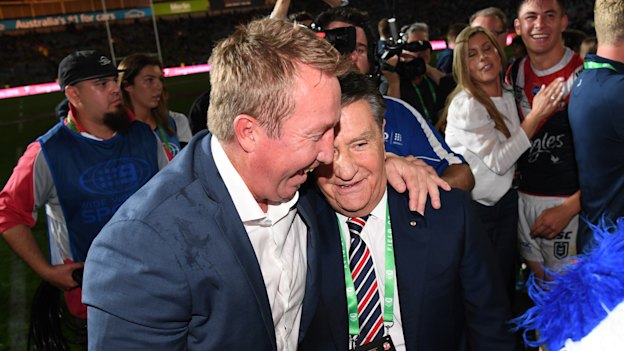 Trent Robinson and Politis share a moment after the 2019 grand final.