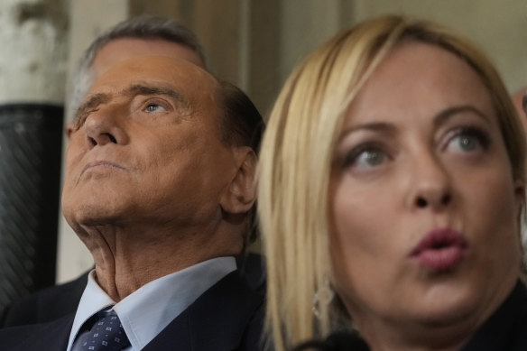 Giorgia Meloni, right and Silvio Berlusconi.