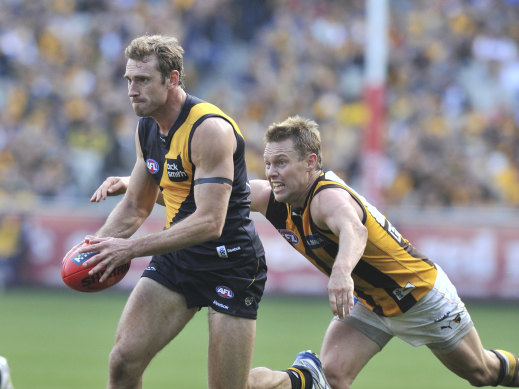 Tuck (left) on the field for Richmond in 2010.