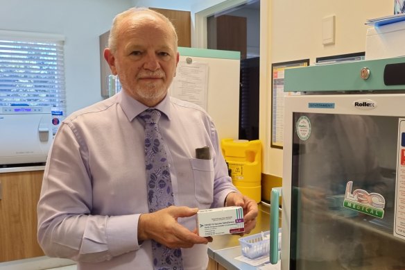 AMAQ councillor Dr Ian Williams with a box of the AstraZeneca doses in his Camp Hill practice on Friday