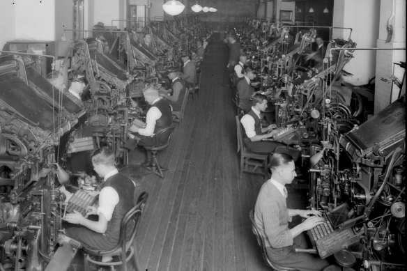 Men operate linotype machines at the Herald. 