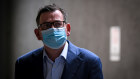 An image that is emblematic of the past 12 months: Victorian Premier Daniel Andrews wears a mask for protection against COVID19.