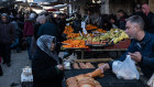 People shop in the old town bazaar market in Aleppo at the weekend. 