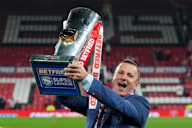 Willie Peters celebrates Super League premiership success.