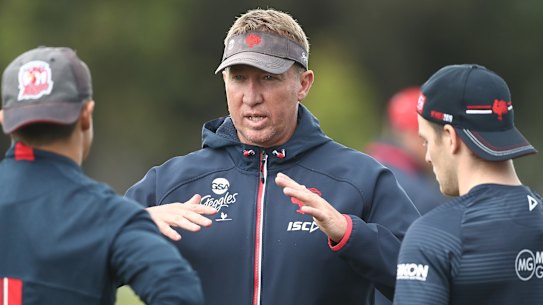Trent Robinson talks to Cooper Cronk and Luke Keary at Roosters training.