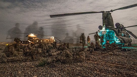 Australian Army soldiers from Special Operations Task Group prepare for a night-time operation in Oruzgan in 2008.