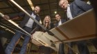 Sypac’s chief engineer Ross Osborne, and its CEO Amanda Holt, join managing director David Vicino and founder and chairman George Vicino with one of the drones that have been deployed in the Ukraine conflict.