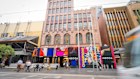 Building hoardings have been erected outside Melbourne’s Mecca superstore as its facade receives a facelift. 