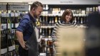 Shoppers at a Dan Murphy’s store in Melbourne. Sluggish sales at the chain have dragged down the company’s profit.