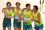 Rohan Browning, Josh Azzopardi, Lachlan Kennedy and Calab Law celebrate after winning the men’s 4x100m relay.