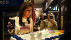 Nikki Haley enjoys a cake and a drink on her birthday while campaigning in Nashua, New Hampshire. 