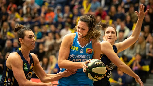 Lauren Scherf, centre, stepped up in the first game of the season on Friday.