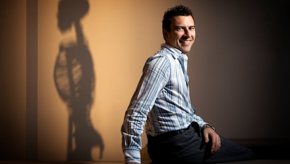 Jason Smith in the early days of Back In Motion which he started from his carport. 