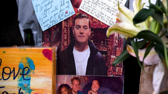 Flowers and tributes left at London Bridge to remember Jack Merritt. 