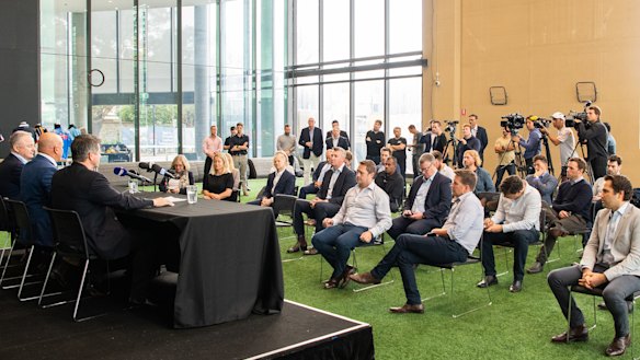 Marks, Clarke and Sneesby take questions at a press conference at Moore Park.